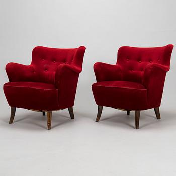 A pair of mid-20th-century armchairs.