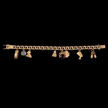 BERLOCKARMBAND, 18k guld med månsten och ametist, Gustav Dahlgren & Co, Malmö, 1963. Vikt 22 g.