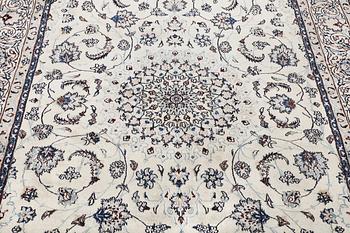 A Nain carpet, part silk, c. 294 x 193 cm.