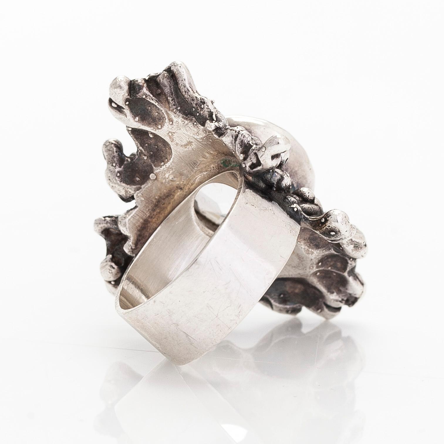Pentti Sarpaneva, a silver and rock crystal necklace, ring and earrings, Turun Hopea, Turku.
