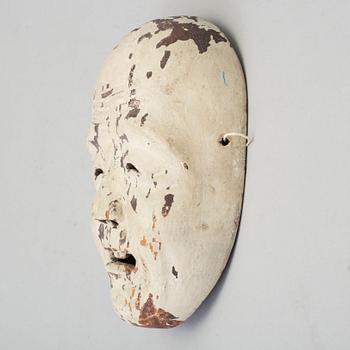 A Japanese wooden mask, 20th century.