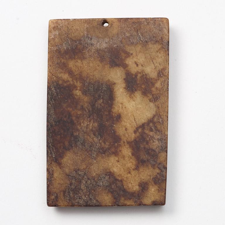 A group of three archaistic Chinese stone bi discs and two pendants.