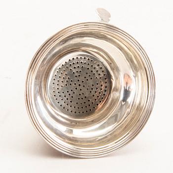 A 19th century English silver wine-strainer London 1813.