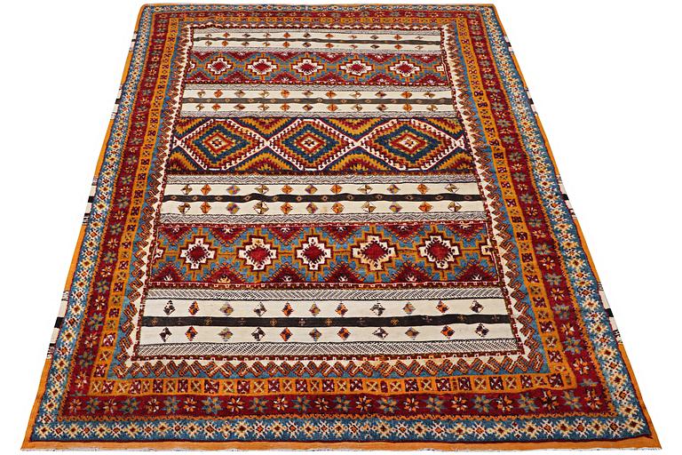 A North African carpet, c. 318 x 193 cm.