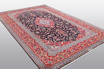 A carpet, Kashan signed Najafi, ca 360 x 231 cm.