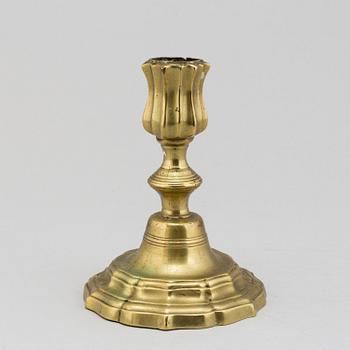 An 18th century rococo argent haché candlestick.