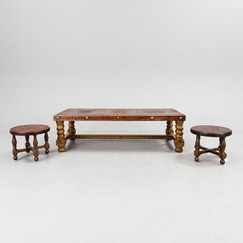 A Peruvian leather covered coffee table and pair of stools, second half of the 20th Century.