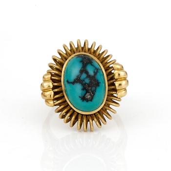 RING, med cabochonslipad turkos.