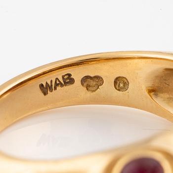 A W.A. Bolin ring in 18K gold with cabochon-cut rubies and eight-cut diamonds.