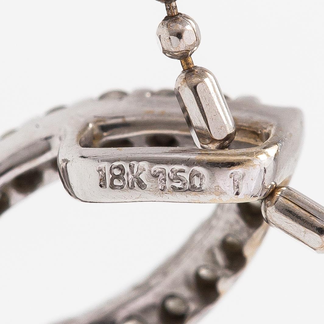 An 18K white gold neckalce with diamonds ca. 0.48 ct in total.