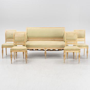 A late Gustaivan style sofa and four matched chairs from around the year 1900.