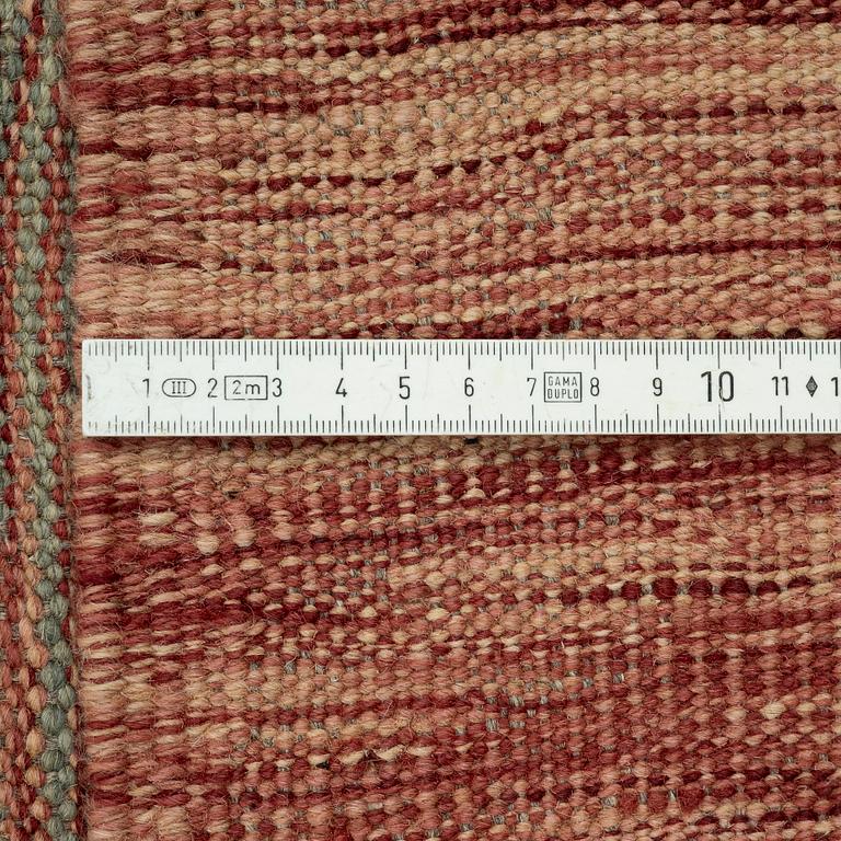 A kilim carpet, 304 x 203 cm.