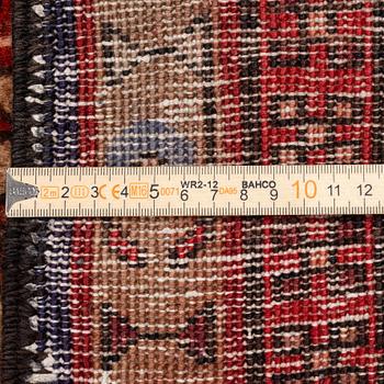 A Sarab carpet, c. 305 x 137 cm.