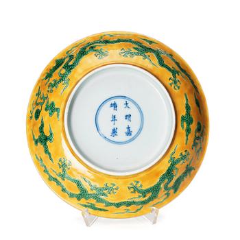 880. A yellow and green glazed anhua decorated five clawed dragon dish,  Qing dynasty with Jiajing mark.