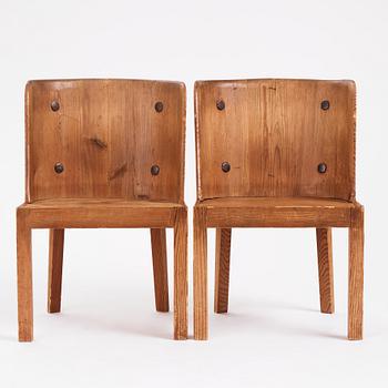 Axel Einar Hjorth, a pair of "Lovö" stained pine armchairs, Nordiska Kompaniet 1930s.