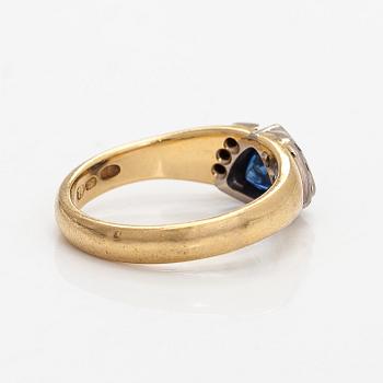 Ring, faceted sapphire, diamonds, 18K gold, H. Tuomaala, Finland 2001.