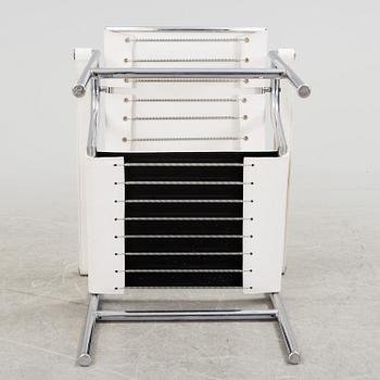 A "LC-1" ARMCHAIR DESIGNED BY LE CORBUSIER FOR CASSINA.