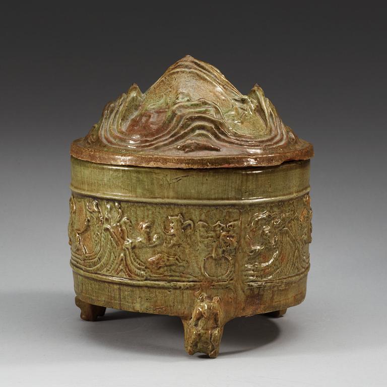 A green glazed tripod censer with cover, Han dynasty (206 BC - 220 AD).