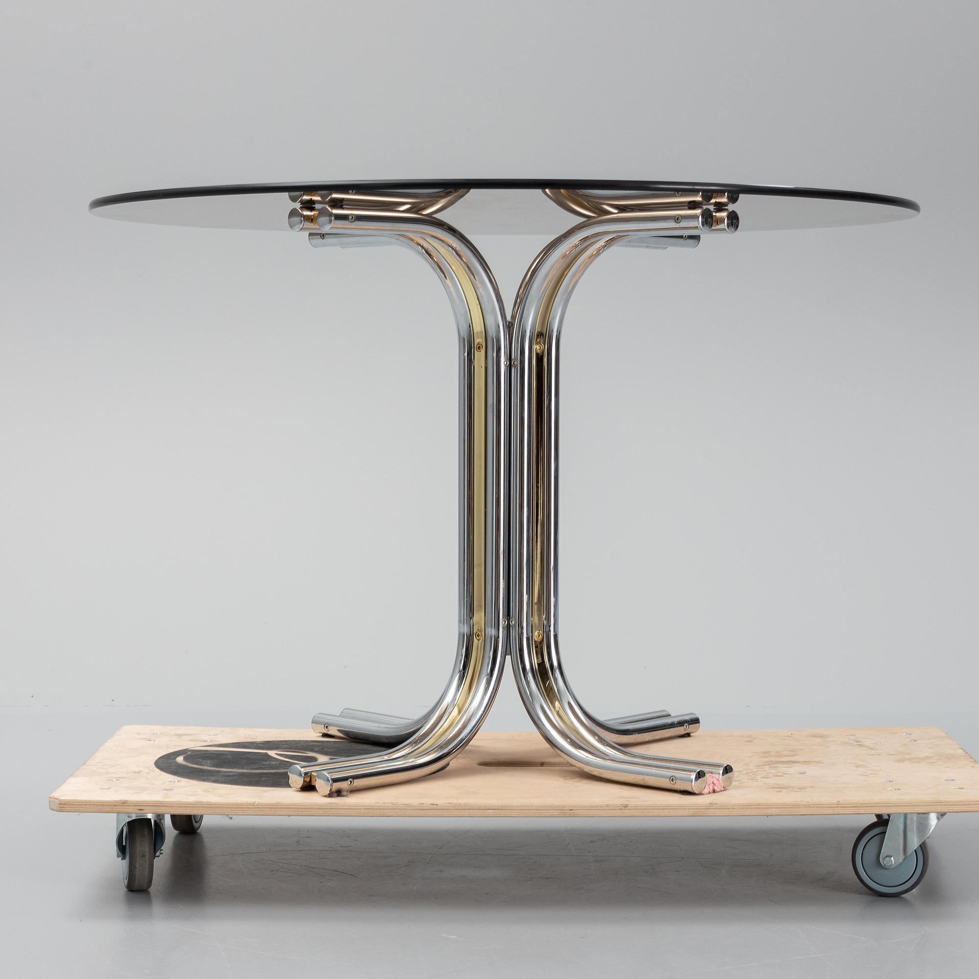 An iIalian glass top dining table, 1970's/80's.
