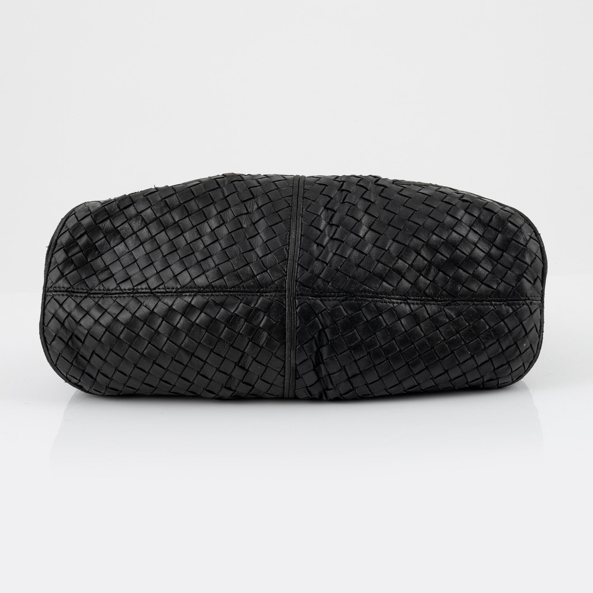 Bottega veneta, a black leather bag.