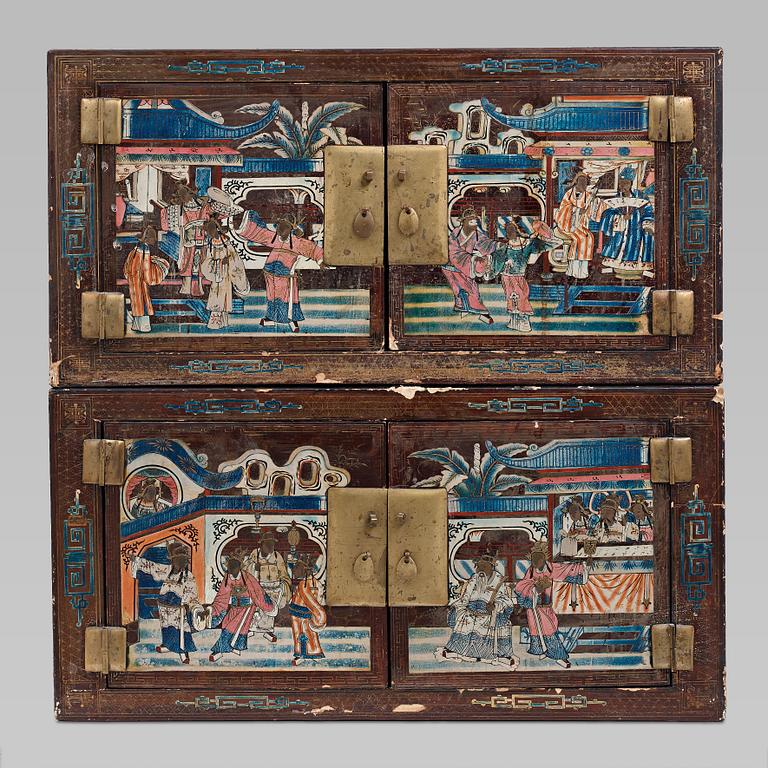 A lacquered cabinet, in two sections, Qing dynasty, 19th Century.