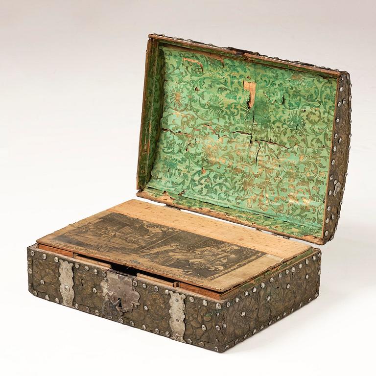 A presumably German baroque repoussé brass writing box, late 17th century.
