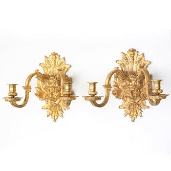A pair of Baroque-style mid 19th century two-light wall-lights.