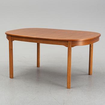 An 'Ambassadör' dining table with eight chairs by Carl Malmsten, second half of the 20th Century.