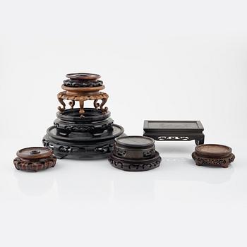 A group of nine hardwood stands, late Qing dynasty and 20th Century.