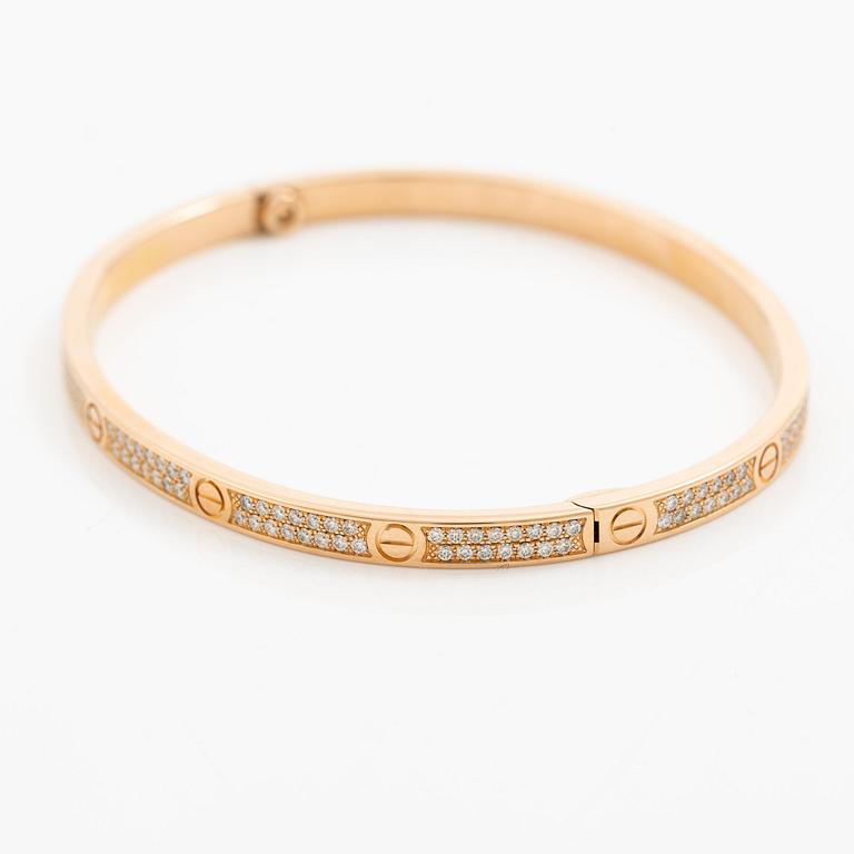 A Cartier bangle "Love" 18K rose gold with round brilliant-cut diamonds.