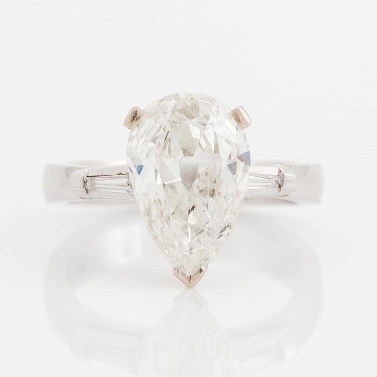 A platinum ring set with a pear shaped old-cut diamond weight ca 3.00 cts quality ca I si2.