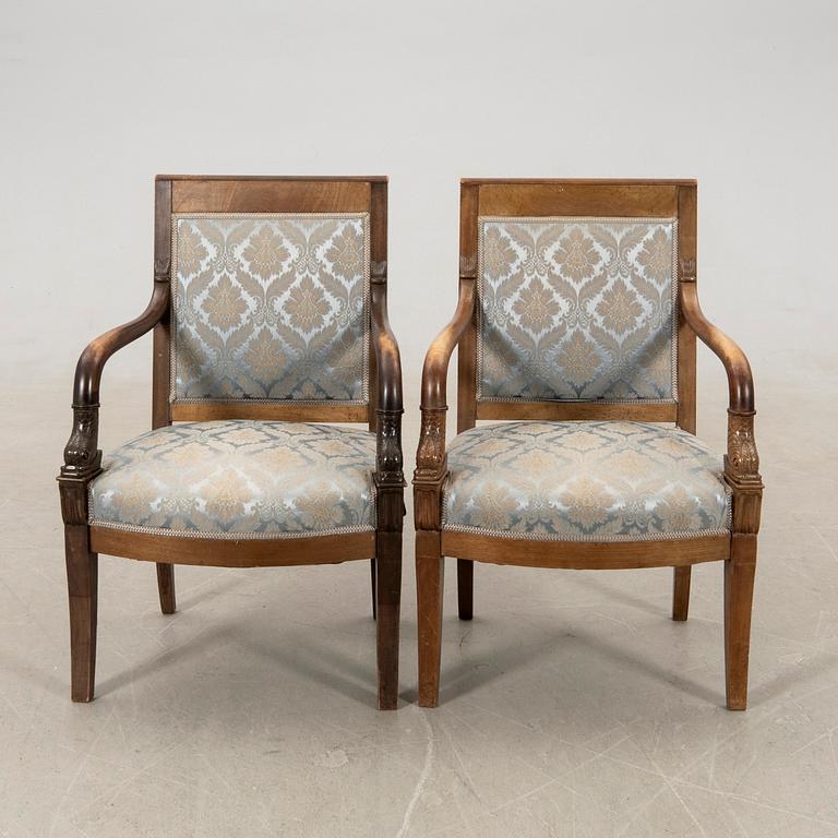 Armchairs, a pair in the Empire style, circa 1900.