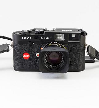 a black body Leica M4-P camera with no 1605951 made by Leitz Canada in 1982. With two lenses and a Leica Meter.