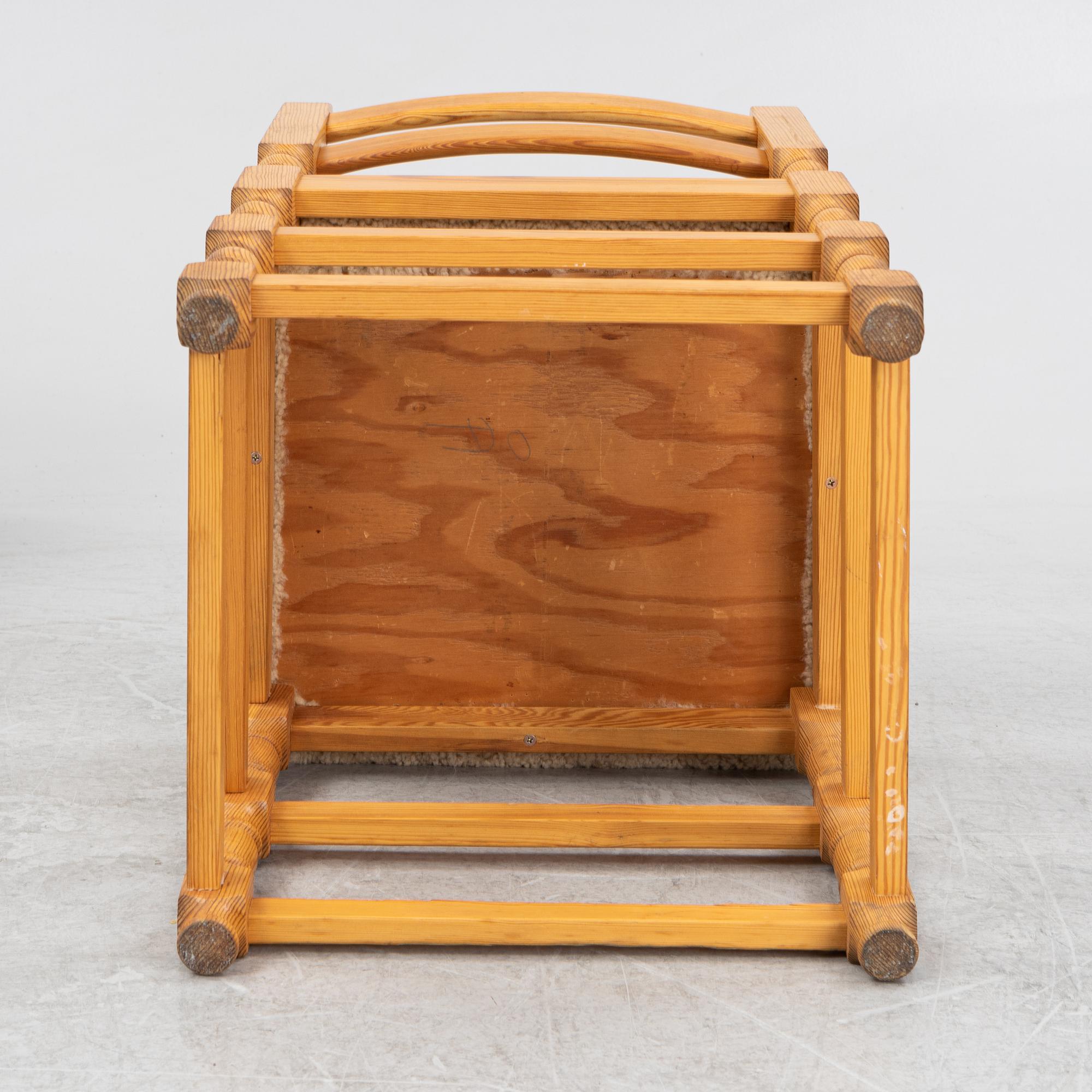 A set of eight pine chairs with new sheepskin upholstery, 1970s.