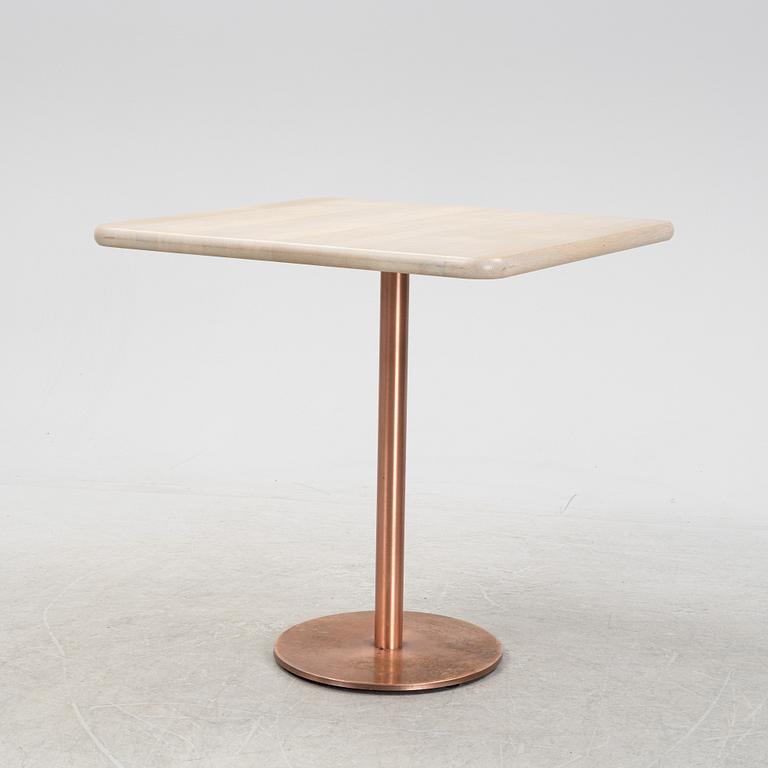 A steel and oak table by Jonas Lindvall 2011.