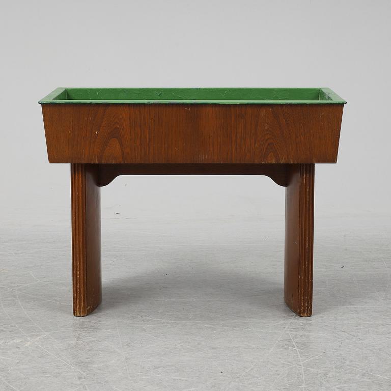 NORDISKA KOMPANIET, possibly be Carl Axel Acking, an oak plant stand from 1942.