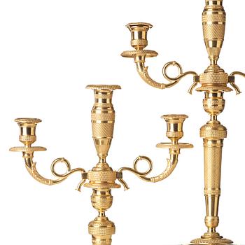 A pair of French Empire three-light candelabra, beginning of 19th century.