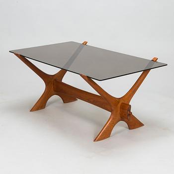A coffee table in wood and glass, 1960s-1970s.