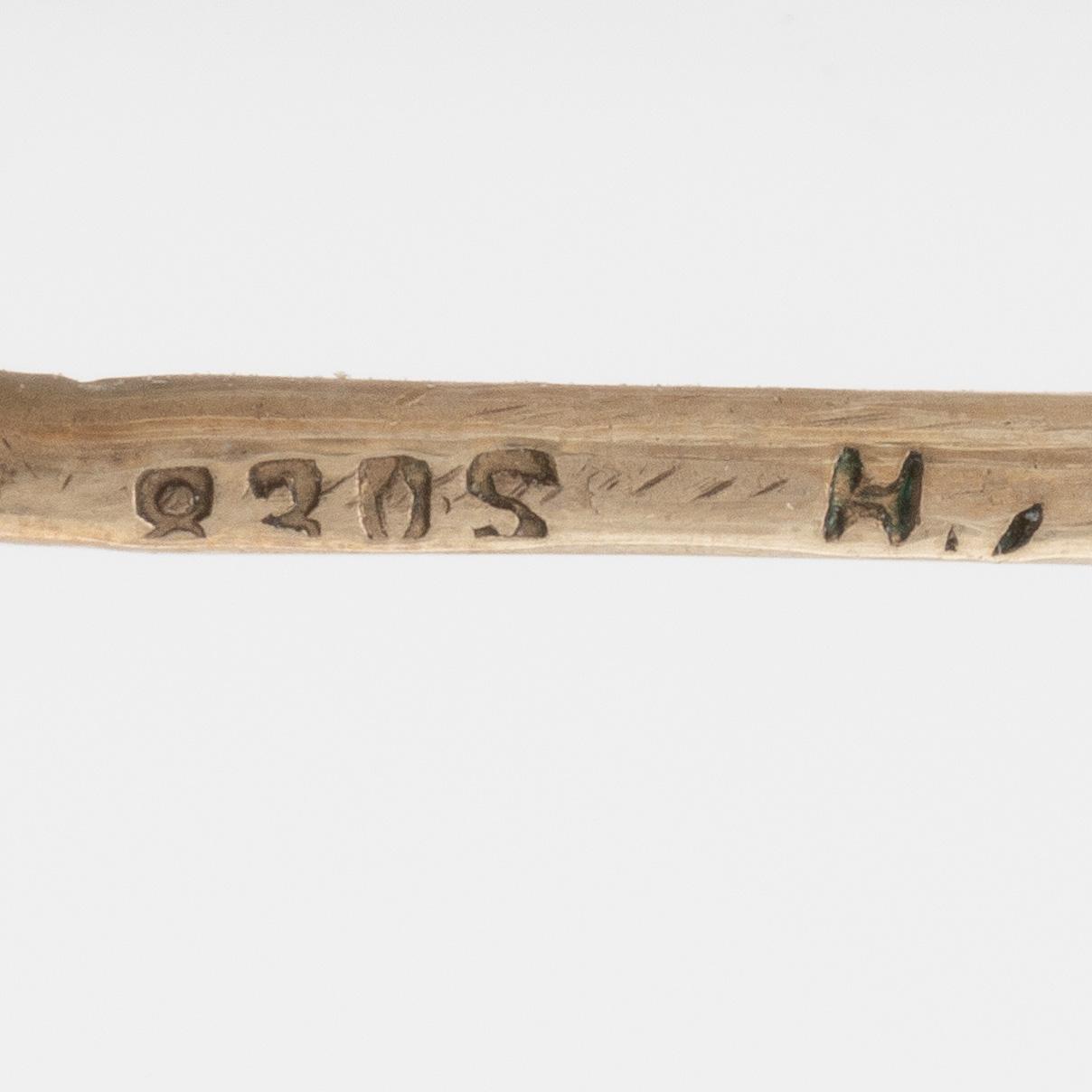 A set with a necklace, a bracelet, a brooch, and a ring.