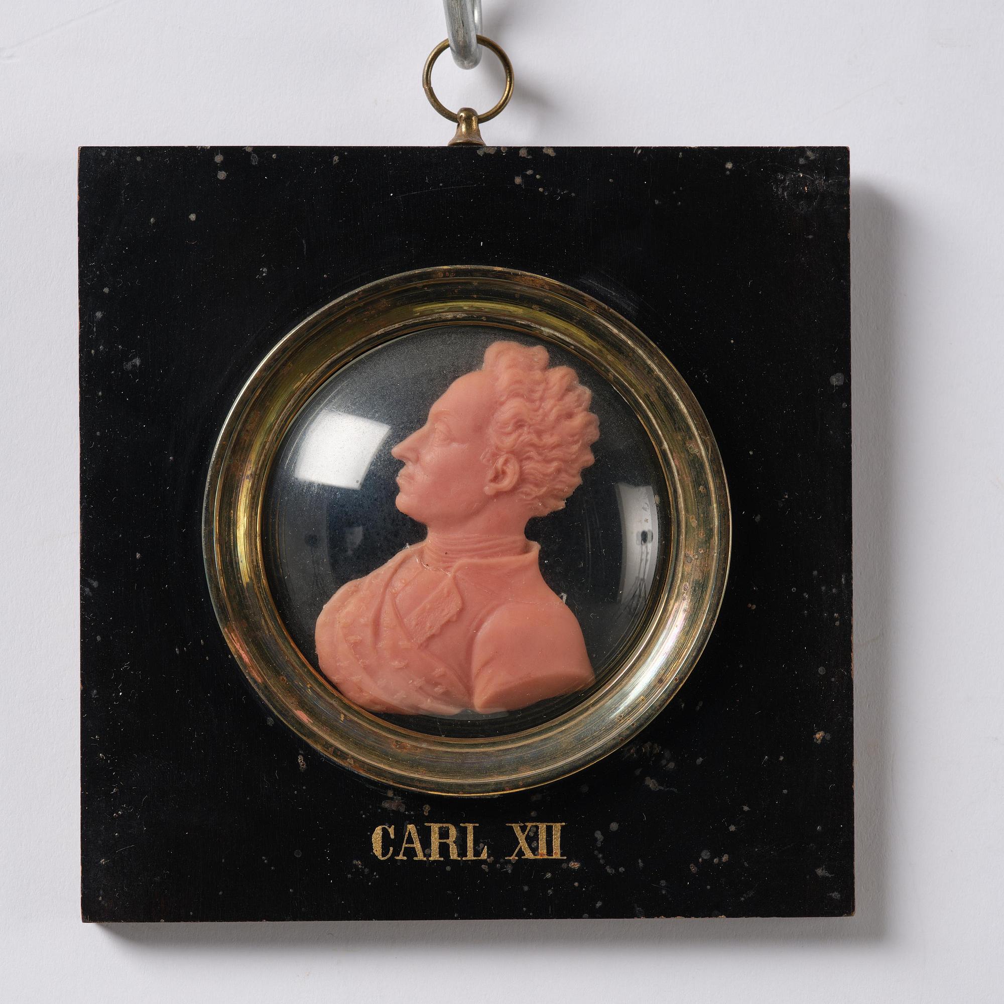 A set of twenty wax portraits of Swedish monarchs, late 19th century.