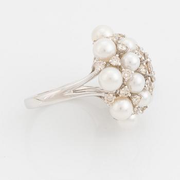 Cultured pearl and brilliant cut diamond ring.