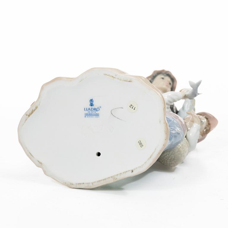 Salvador Furió, figurine, "A fishing lesson", and "A father's pride", Lladró, Spain.