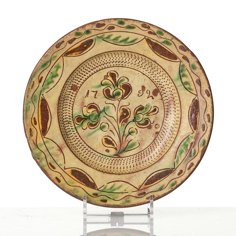 An earthenware dish, dated 1792.