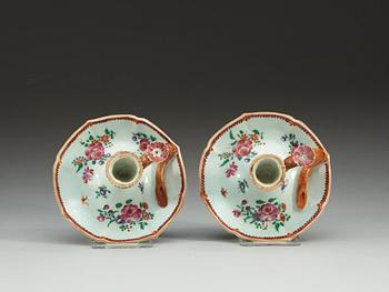 A pair of famille rose candle sticks, Qing dynastin, Qianlong (1736-95).