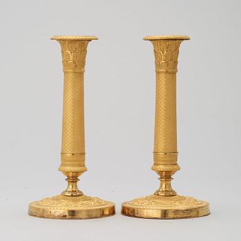 A pair of French Empire 19th century candlesticks.