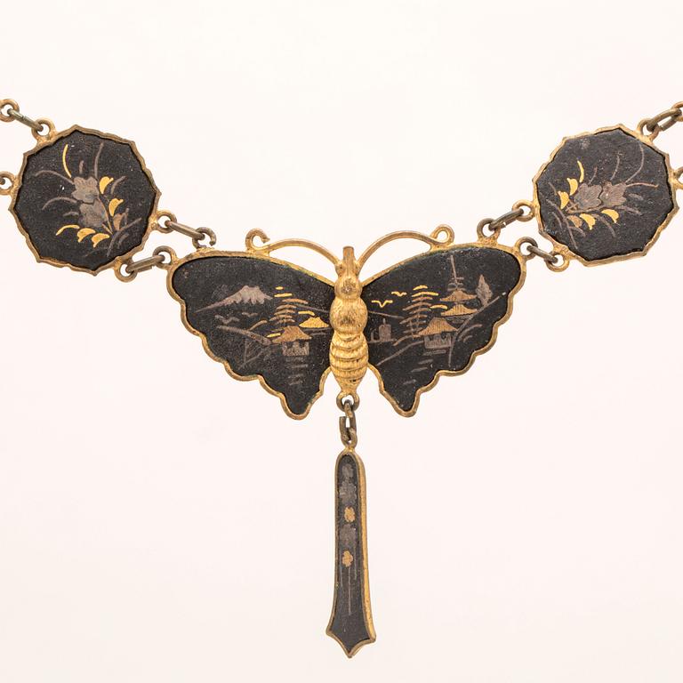 A silver-plated, gilded and lacquered metal parure from Japan, first half of the 20th century.