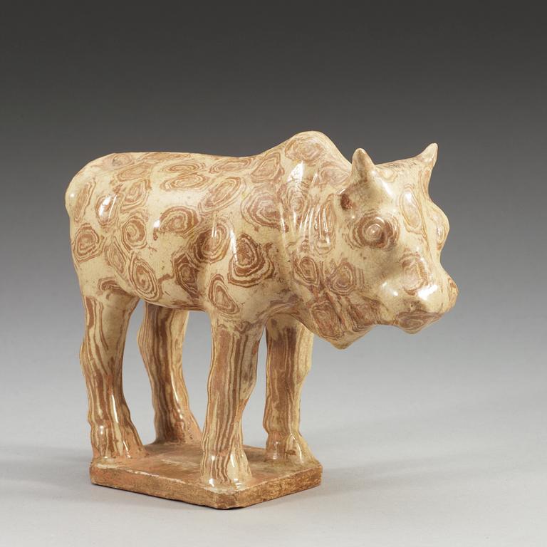 A glazed pottery figure of an ox, Tang dynasty (618-907).