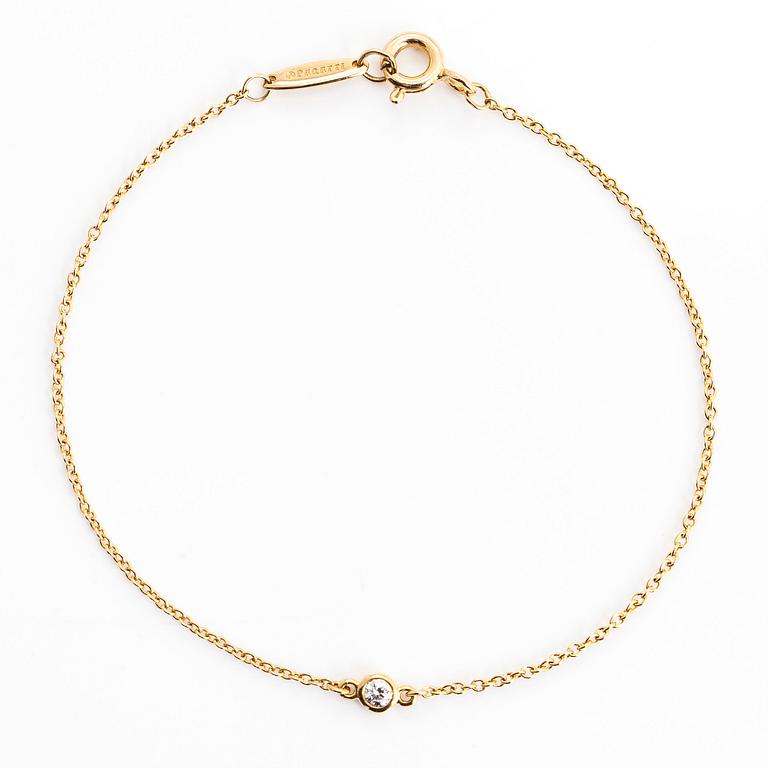 Tiffany & Co, Elsa Peretti, an 18K gold bracelet, 'Diamonds by the Yard', with a diamond approximately 0.05 ct.