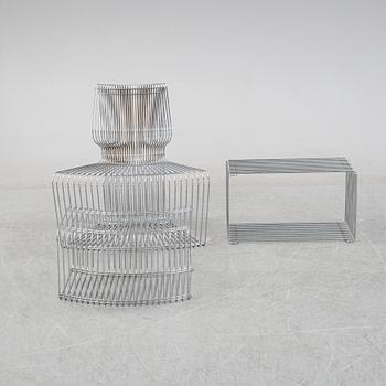 A 'Pantanova convex' chair with foot stool and a 'Wire Extendted' shelf, Verner Panton, Montana, Denmark.