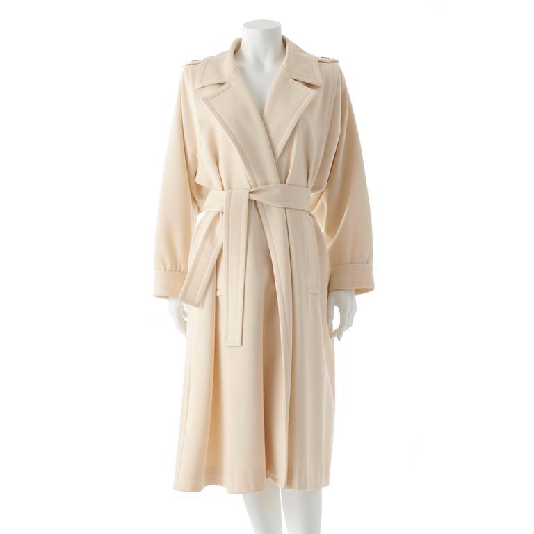 YVES SAINT LAURENT, a creme colored wool blend coat.